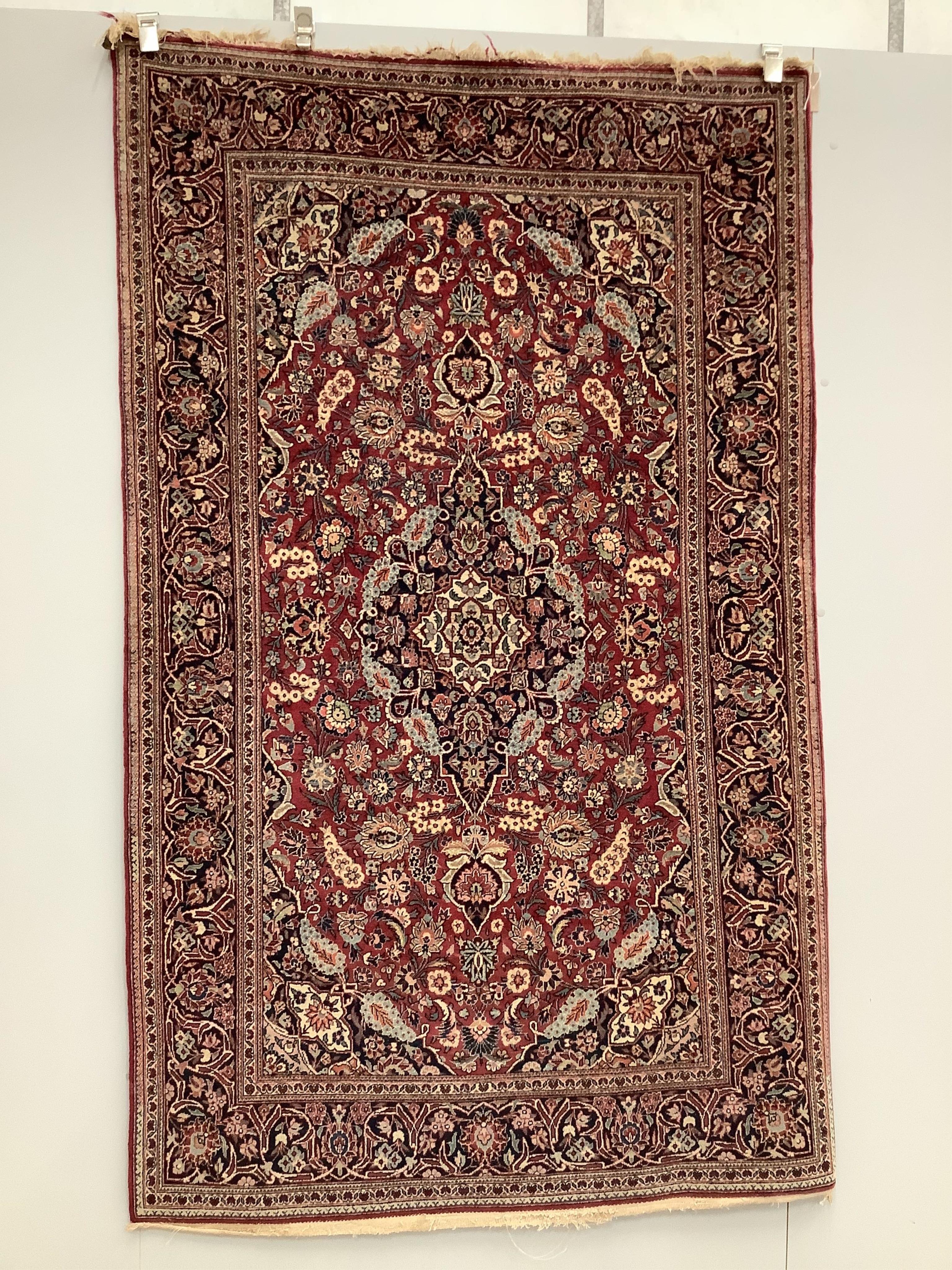 An Isphahan blue medallion rug, with a pink field, 210 x 128cm